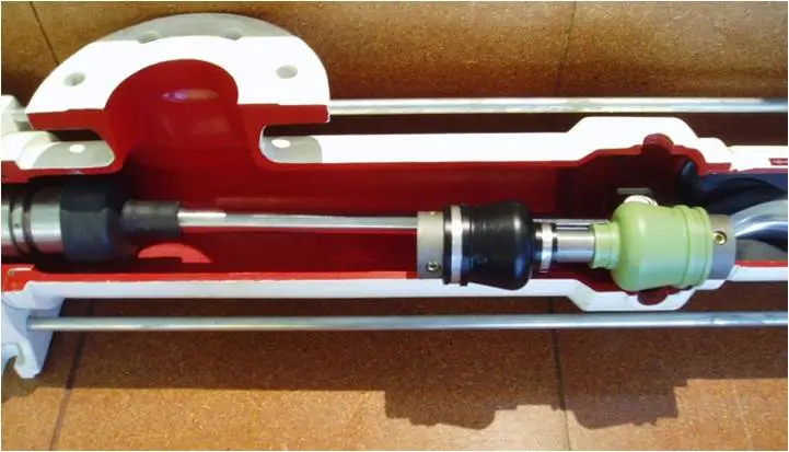 Cutaway of a PCM progressing cavity pump showing the helical rotor inside the elastomer stator